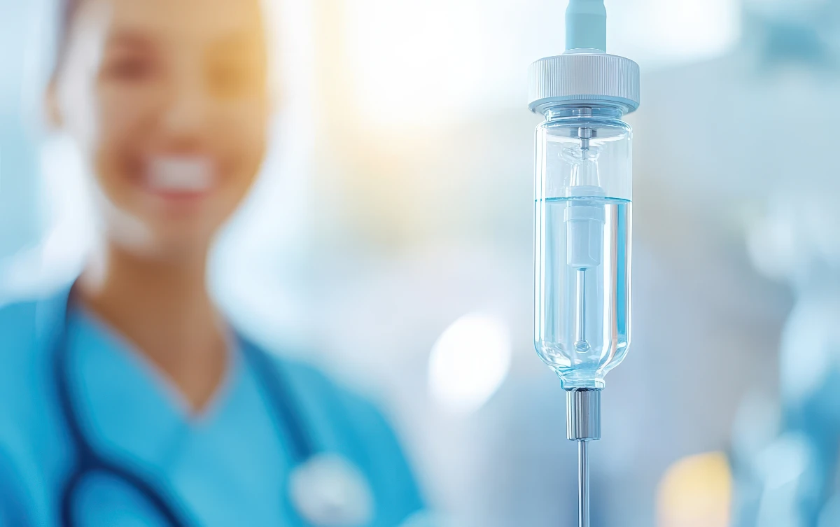 Nurse working with IV THerapy patient.